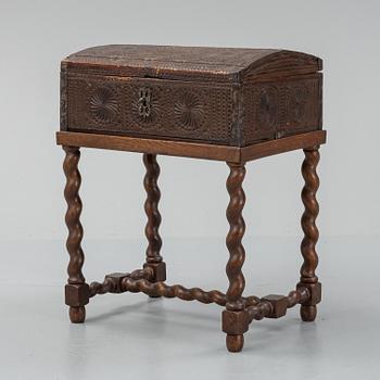 A late 18th or early 19th century wooden box on a stand from early 20th century.