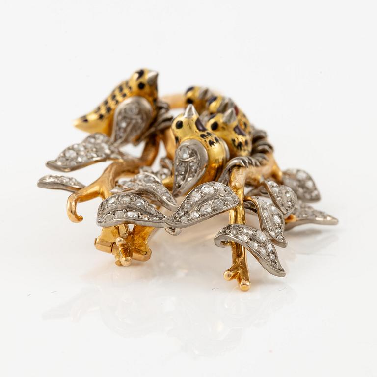 A W.A. Bolin brooch in 18K gold with enamel details and rose-cut diamonds.