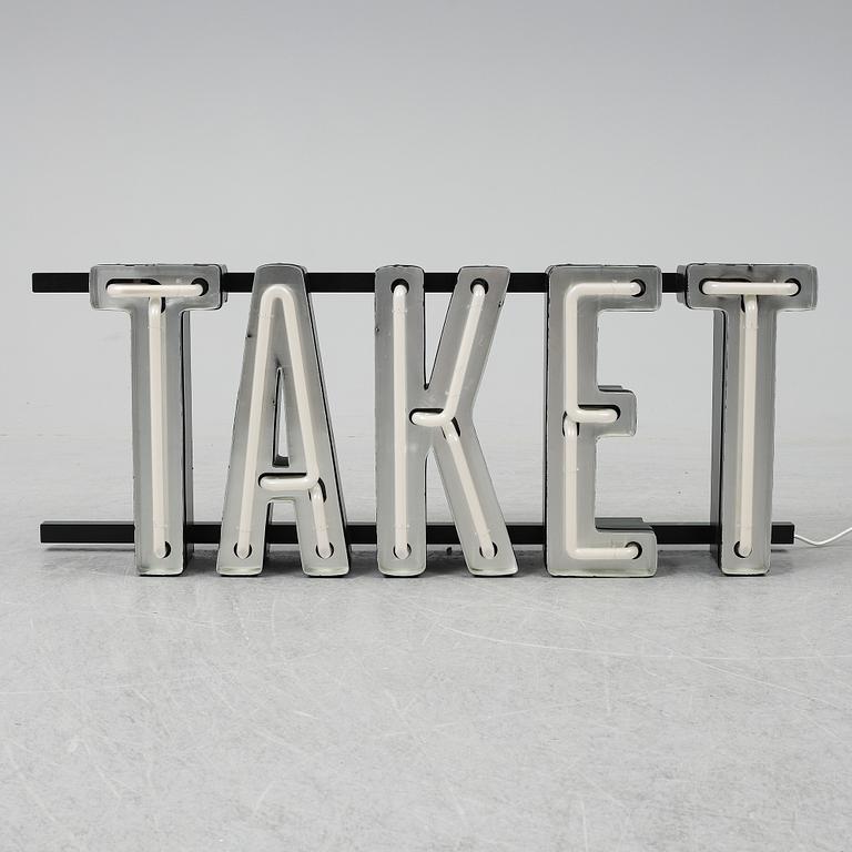 A neon sign "TAKET", late 20th century/21st century.