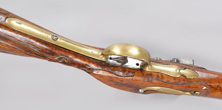 A flintlock rifle, 18th century.