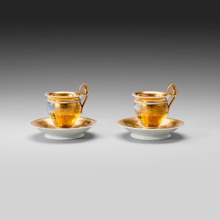 A PAIR OF COFFEE CUPS.
