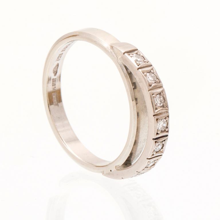 An 18K white gold ring set with round single cut dimamonds.