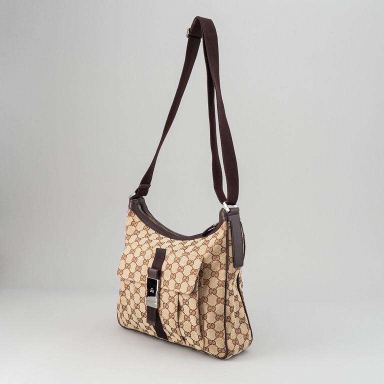 Gucci, a monogram canvas messenger bag.