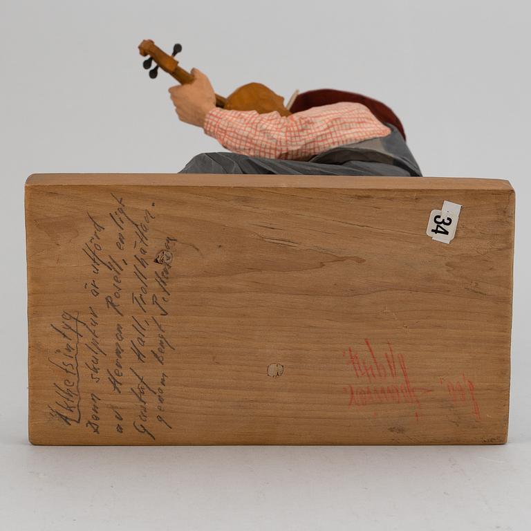 HERMAN ROSELL, a painted wooden sculpture.