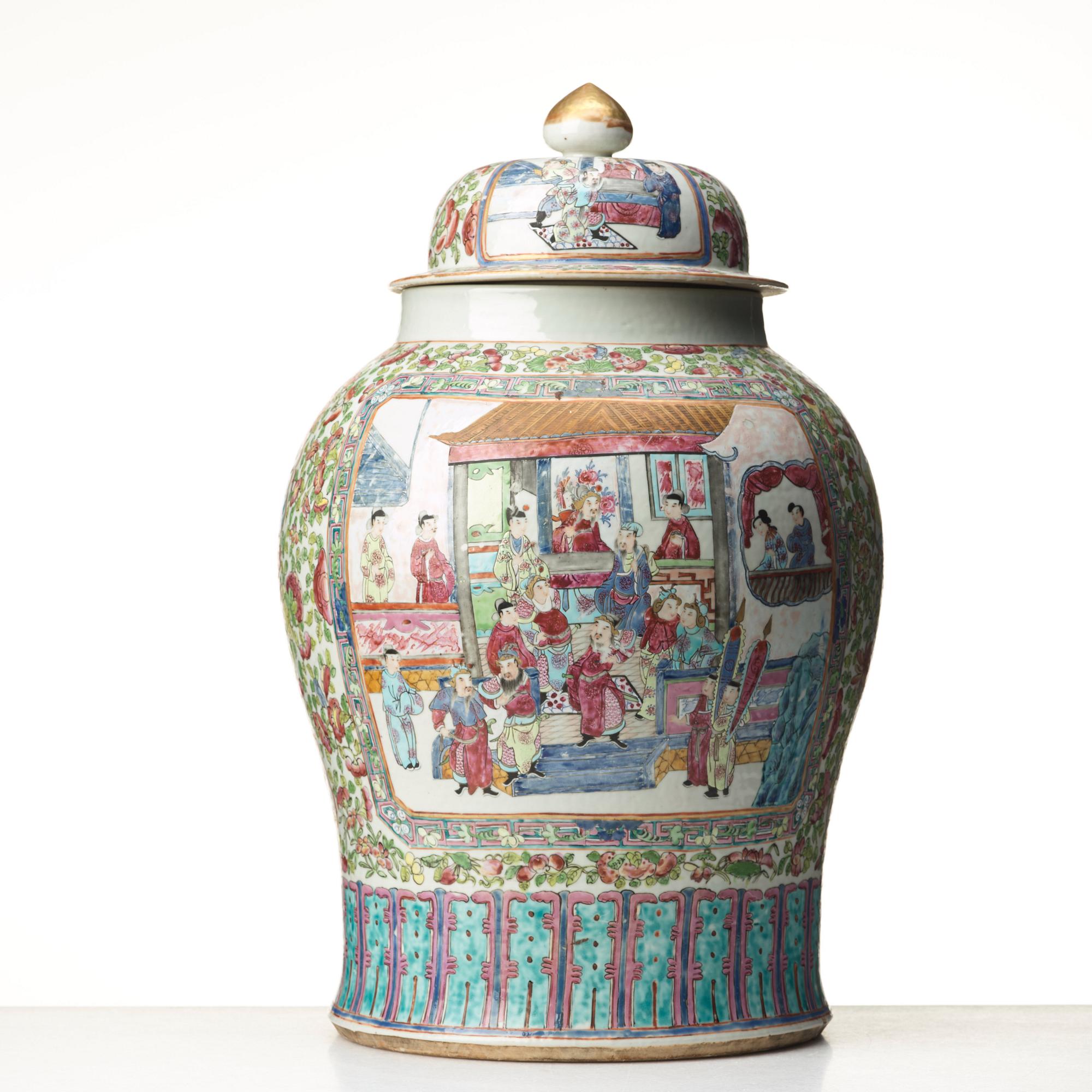 A Canton famille rose jar with cover on a tall wooden stand, Qing dynasty, late 19th Century.