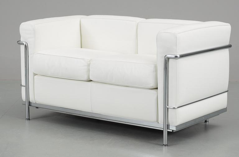 A Le Corbusier, 'LC2' chromed steel and white leather sofa by Cassina, Italy.