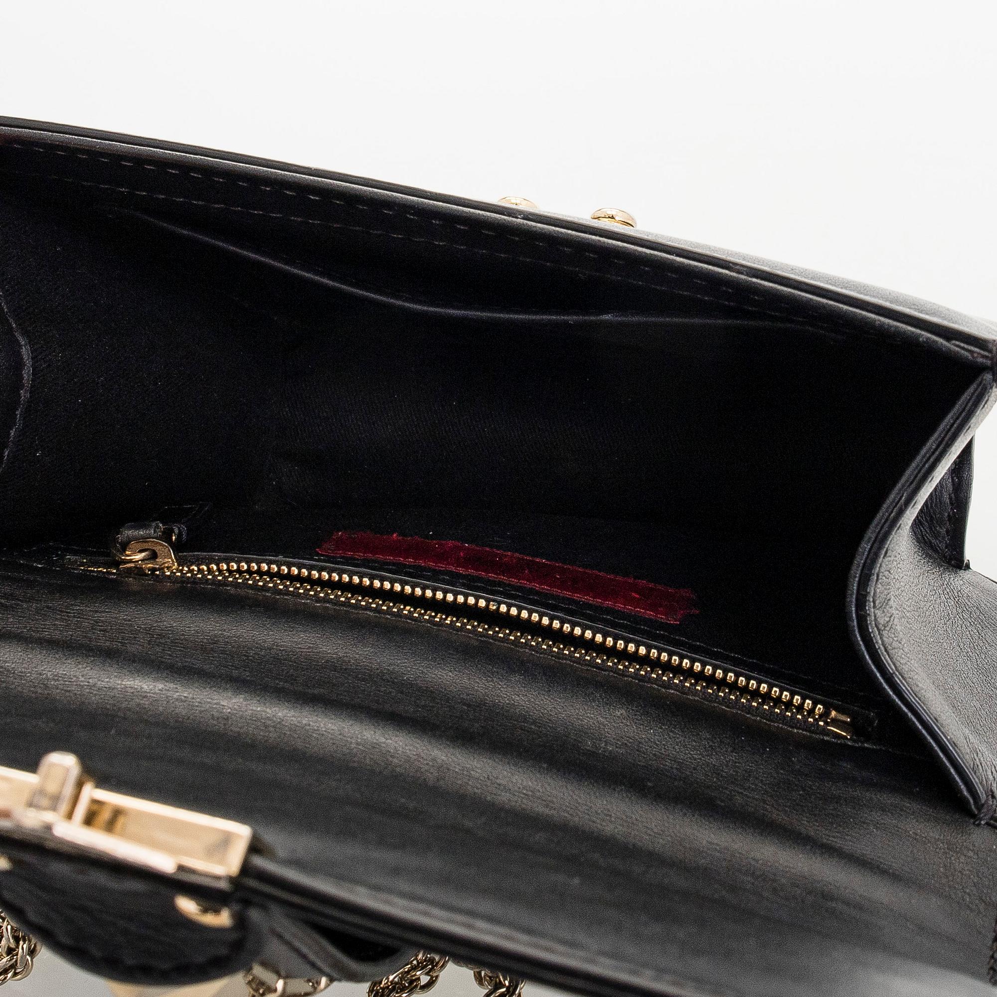 Valentino Garavani, a 'Glam Lock' bag.