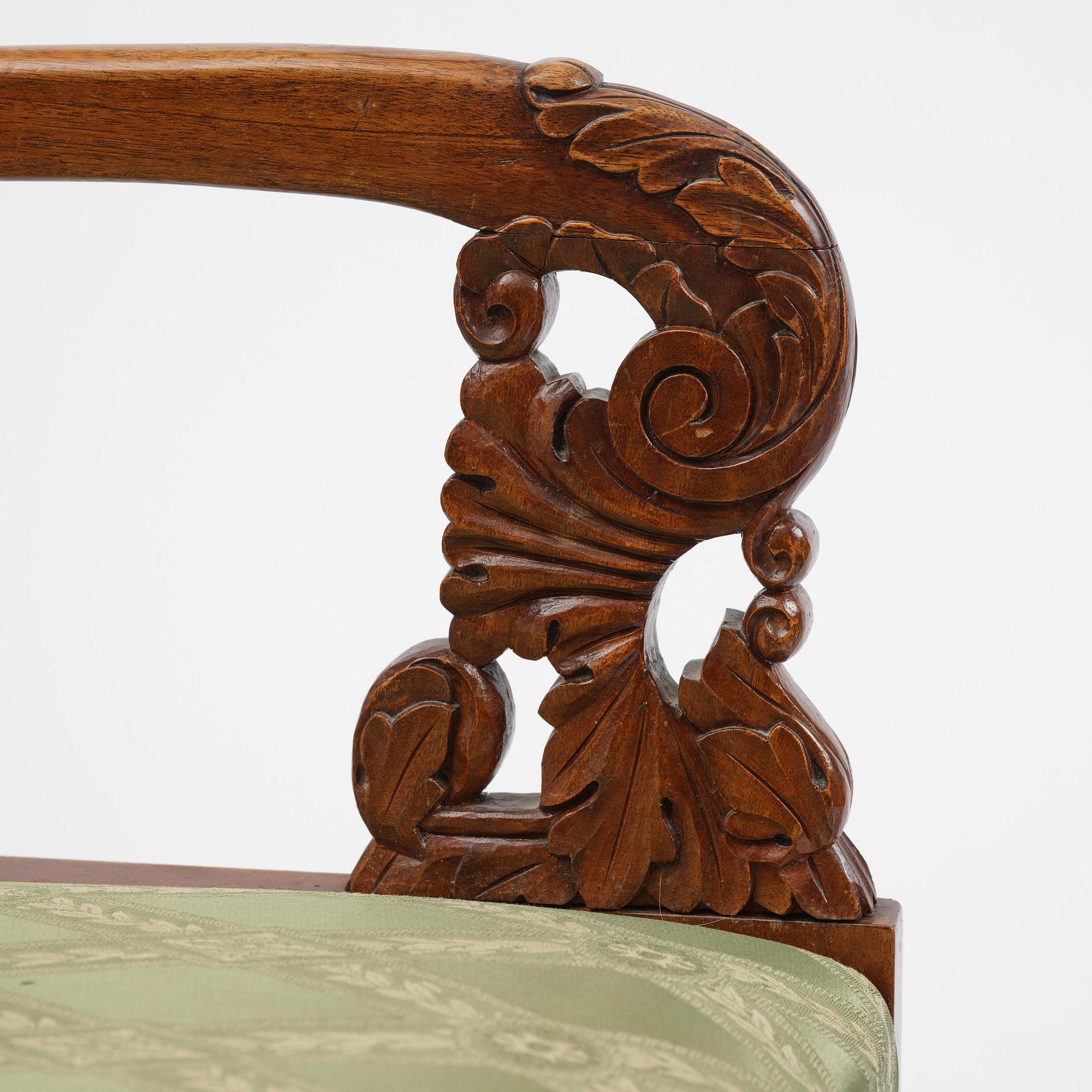 A pair of Baltic / Russian mahogany Empire armchairs, first part 19th century.