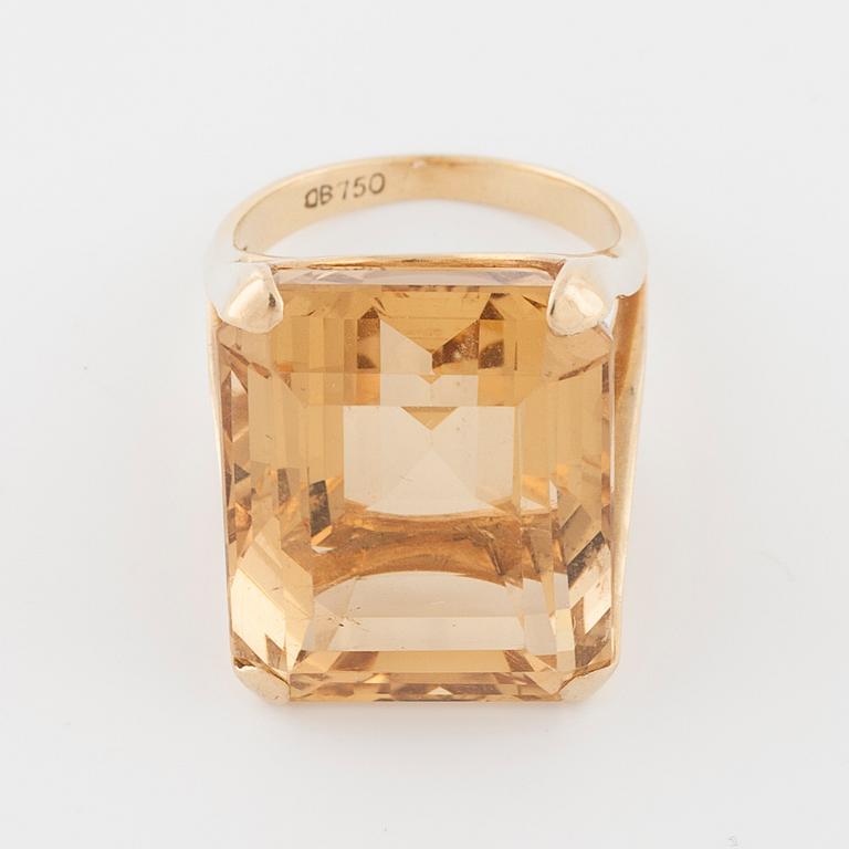 An emerald cut citrin ring.
