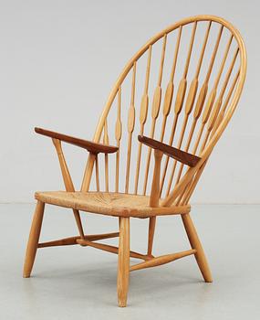 A Hans J Wegner ash and teak 'Peacock chair', Johannes Hansen, Denmark.