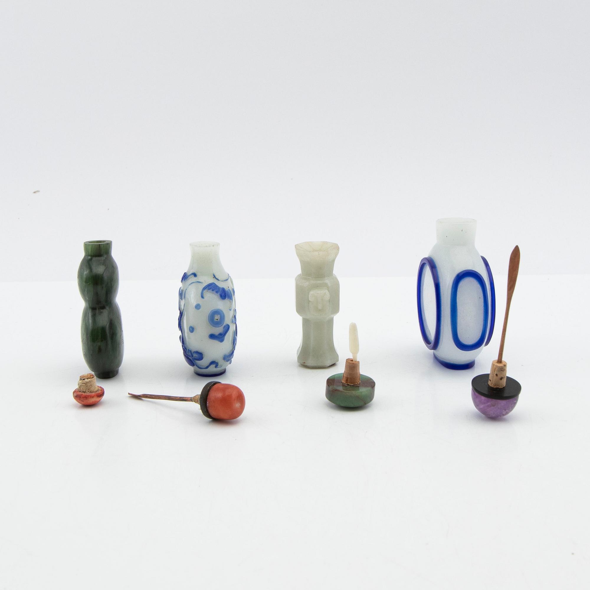 Snuff bottles, four pieces of Peking glass and stone. China, 20th century.
