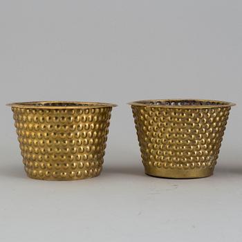 A set of four brass flower pots by Josef Frank for Firma Svenskt Tenn.