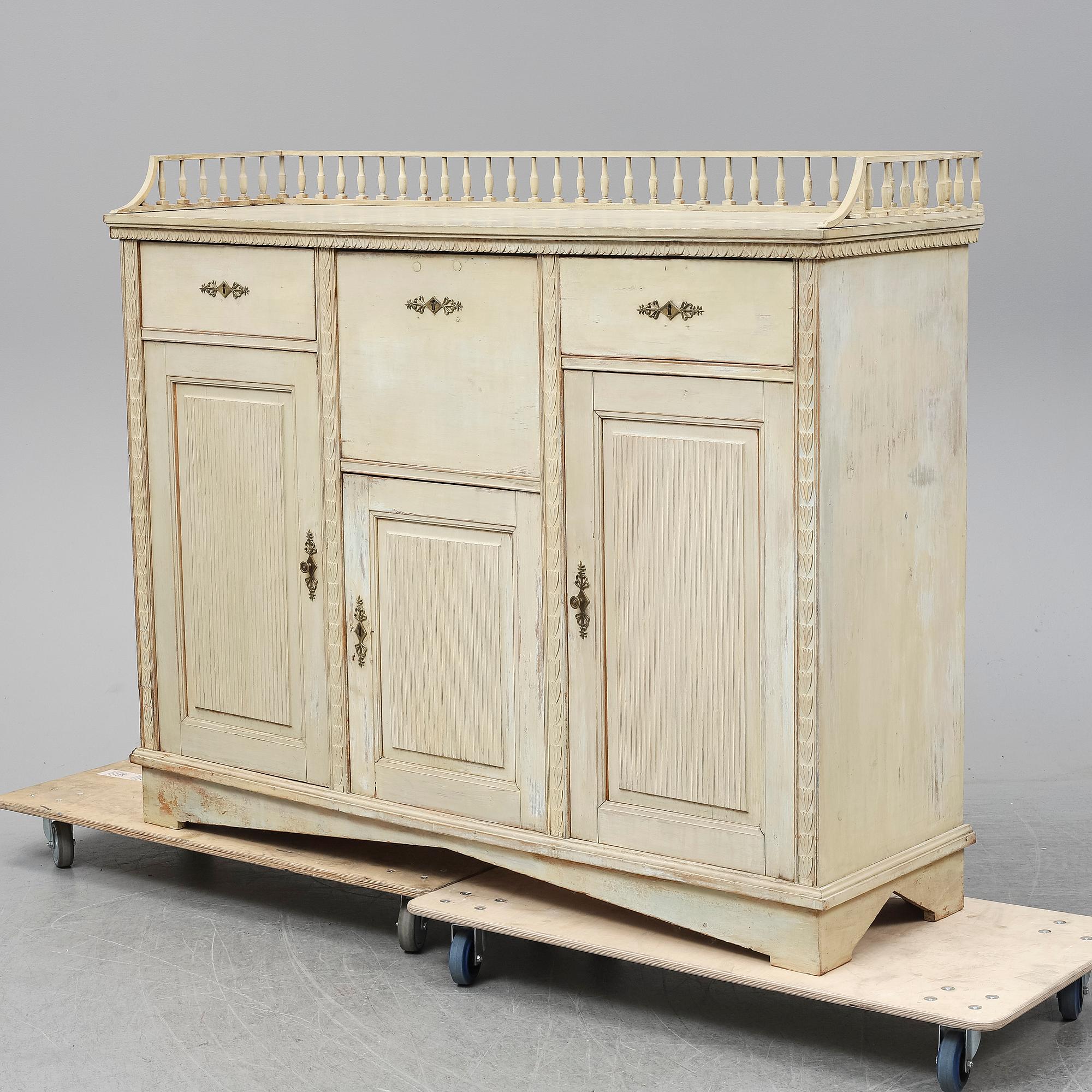 An early 19th Century painted late Gustavian cupboard.