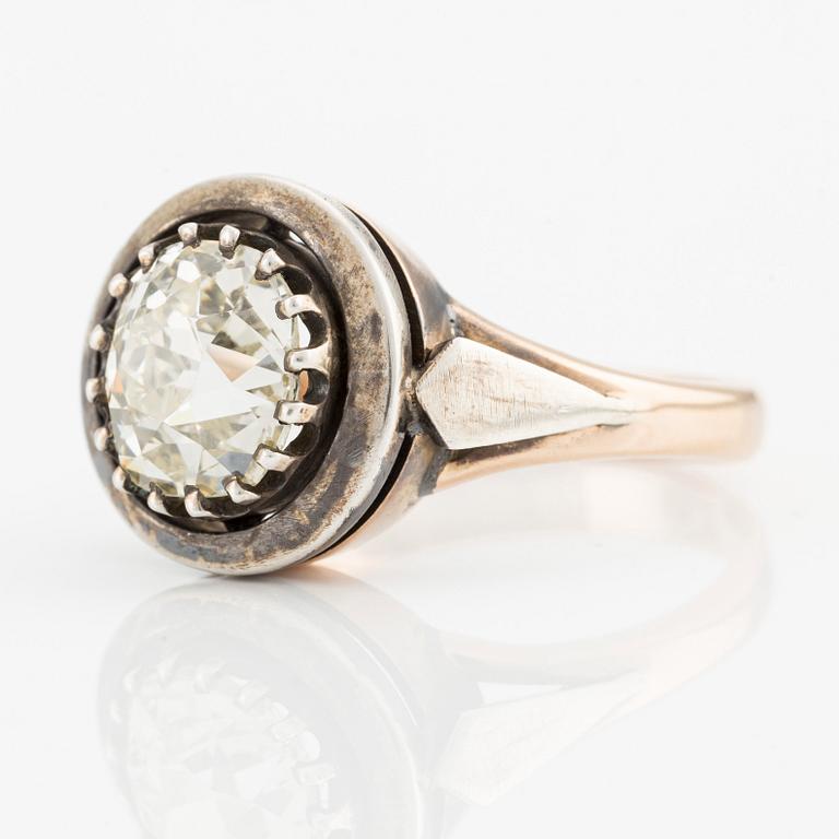 A 14K gold and silver ring with an old-cut diamond.