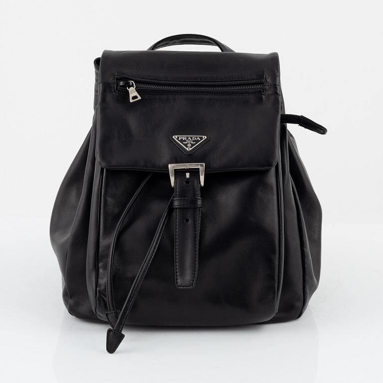 Prada, a leather backpack.