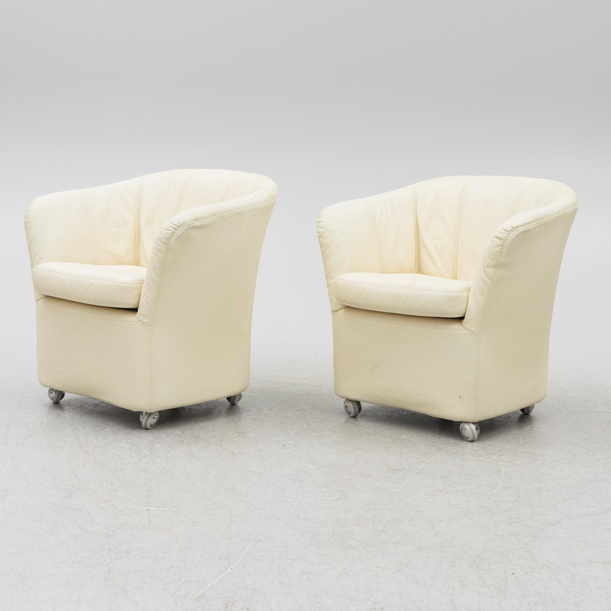 A pair of leather armchairs, Dux, Sweden, 1980's.