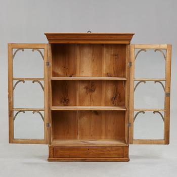 A mid 19th century hanging cabinet.