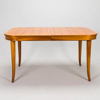 A mid 20th century dining table and a set of four chairs, Oy Boman Ab and two chairs Werner West.