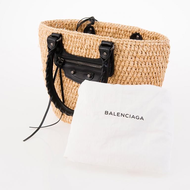 BALENCIAGA Panier leather-trimmed woven raffia tote with a silk scarf.