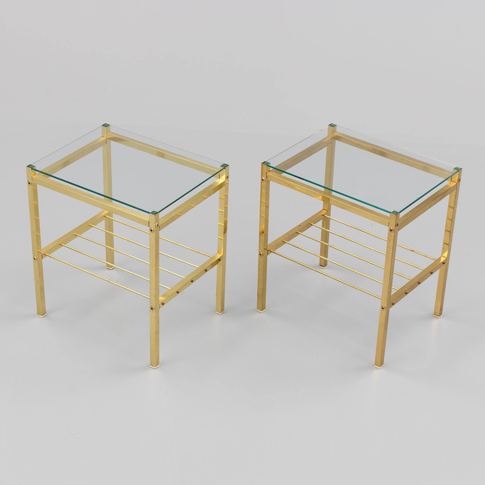 A pair of brass and glass tables, second half of the 20th century.