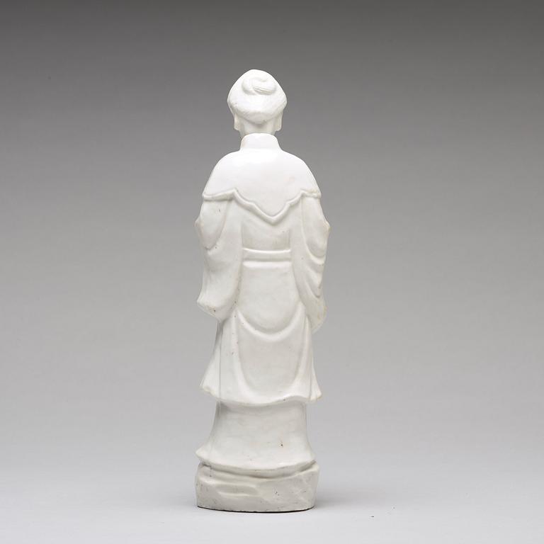 A blanc de chine figure of a lady-in-waiting, Qing dynasty, Kangxi (1662-1722).