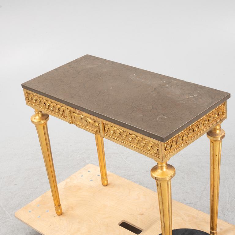 A console table with stone top.