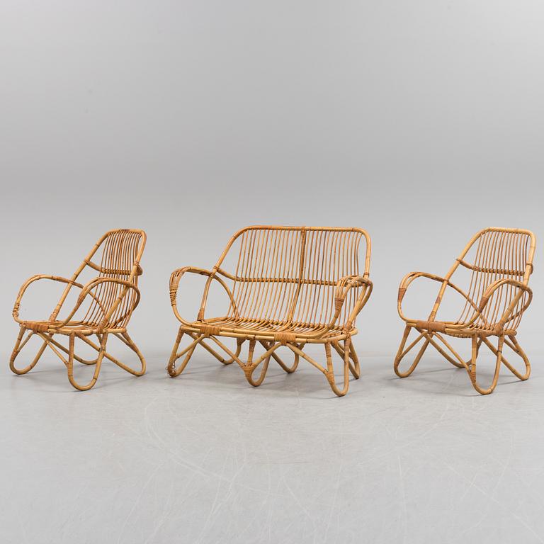 A second half of the 20th century sofa, table and armchairs.