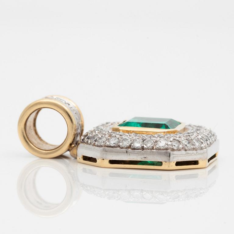 A pendant with a 5.50 ct emerald and cica 1.80 cts of brilliant cut diamonds.