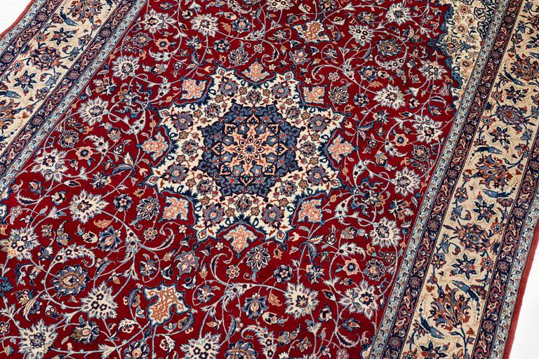 A semi-antique Isfahan rug, Central Persia, signed (Sadegh) Seirafian, c. 237 x 146 cm.