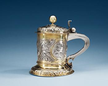 A GERMAN PARCEL-GILT TANKARD, Makers mark of Johannes Paul Schmidt (1683-1703), Leipzig.