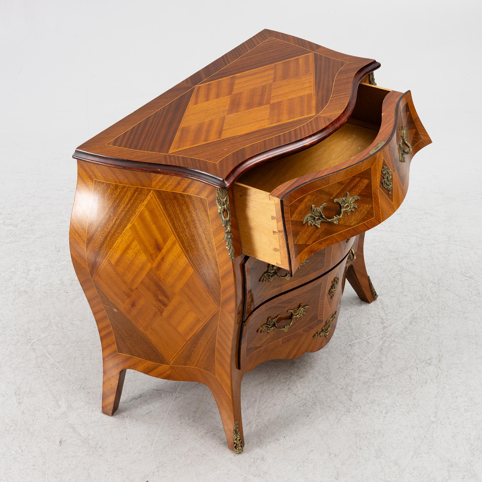 A Rococo style chest of drawers, mid-20th century.