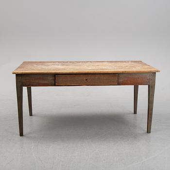 A 19th Century table with drawers.