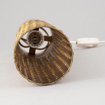 A brass table lamp by Pierre Forssell, second half of the 20th Century.
