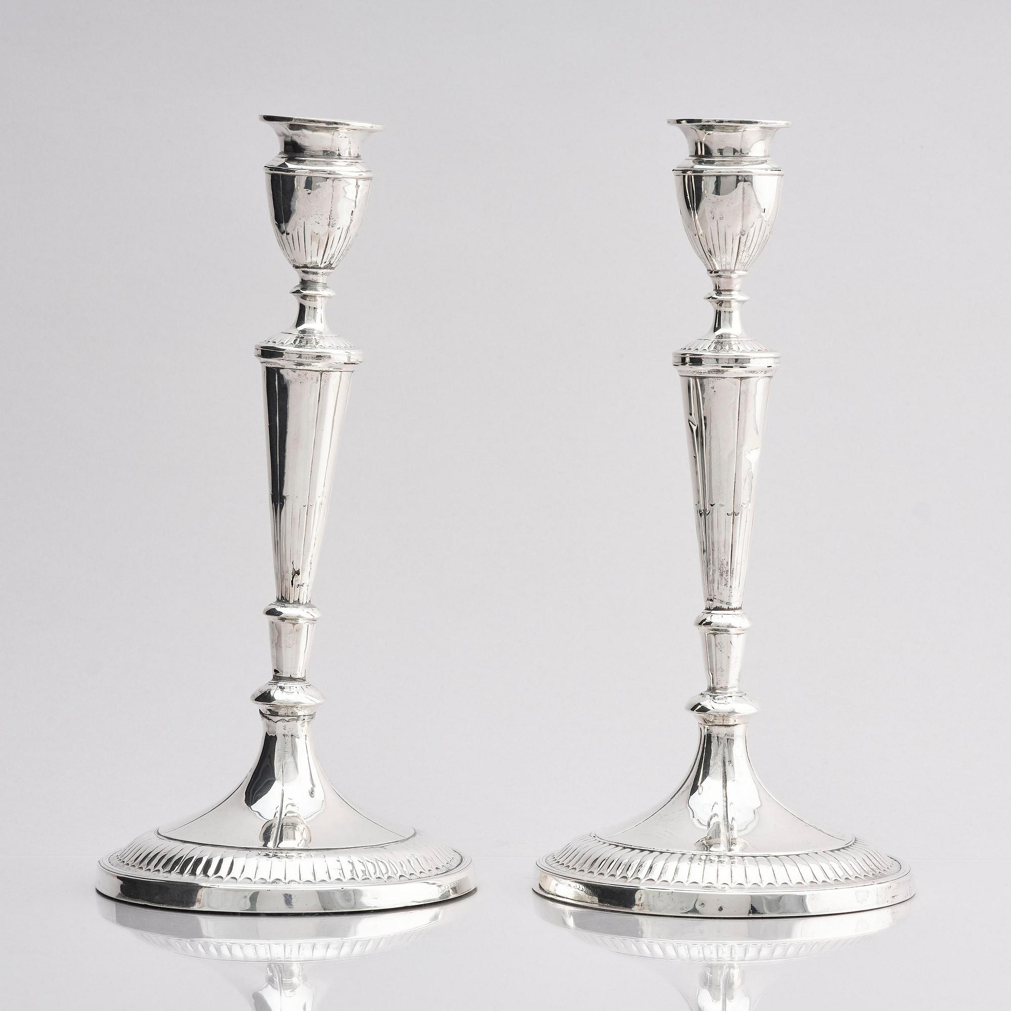 A pair of 18th century silver candlesticks, marks of John Parson & Co, Sheffield 1791.