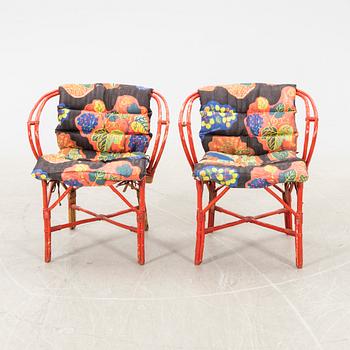 A pair of painted rattan armchairs possibly by Svenskt Tenn.