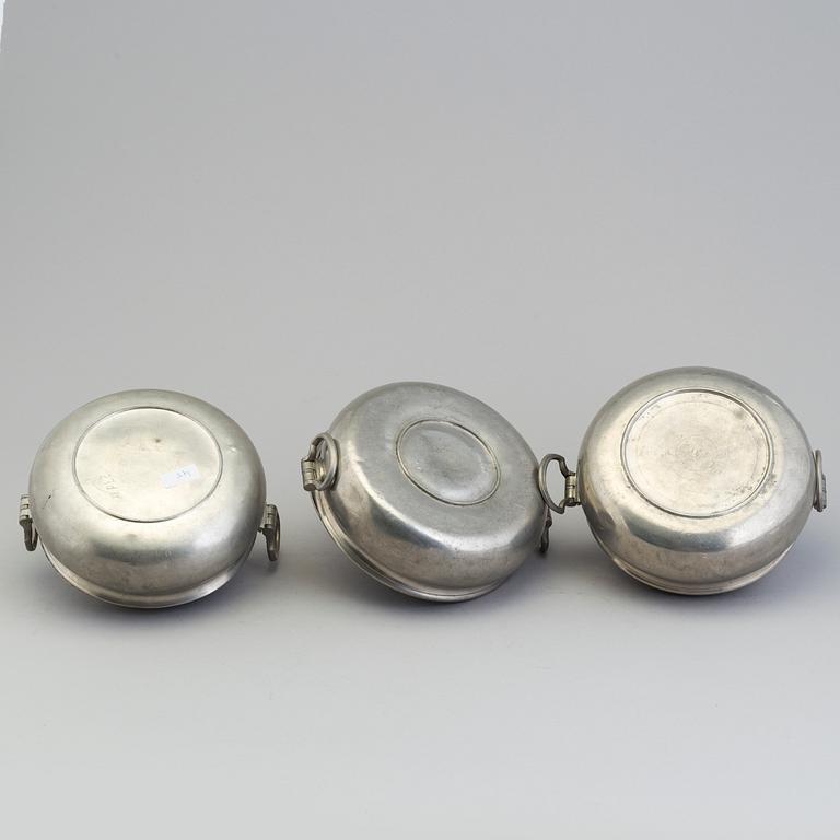 A set of three tin PORRIDGE BOWLS, 19th century.