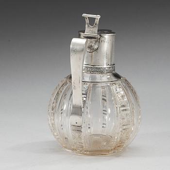 A Russian early 20th century glass and parcel-gilt jug, makers mark of the firm Morozov, (S:t Petersburg).