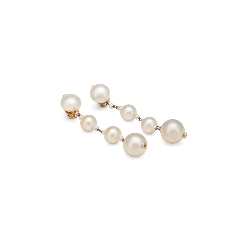 CHANEL, a pair of decorative pearl earclips set in gold colored metal.