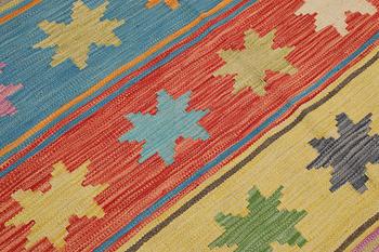 A Kilim rug, approx. 251 x 175 cm.