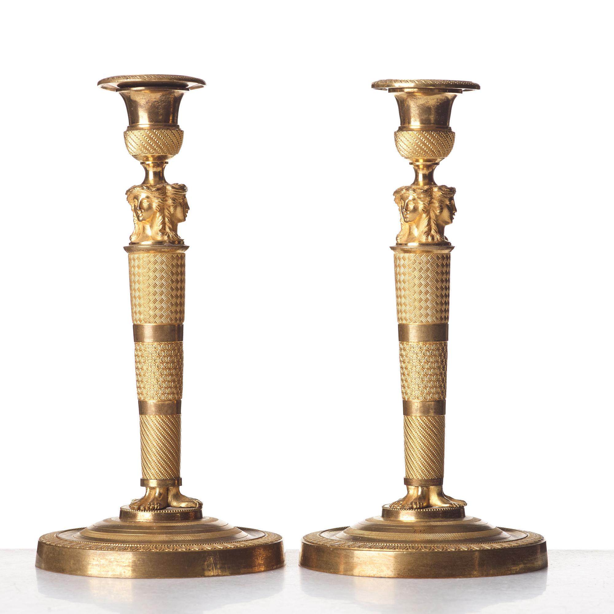 A pair of French Empire candlesticks, early 19th century.