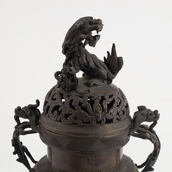 A tripod bronze censer with cover, Qing dynasty, 19th century.
