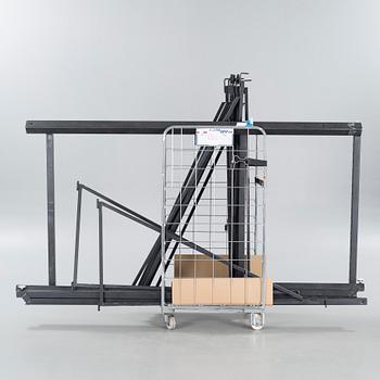 A 21st century showroom rug hanger.