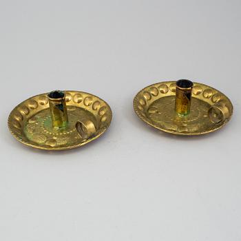 A pair of brass baroque style candlesticks.