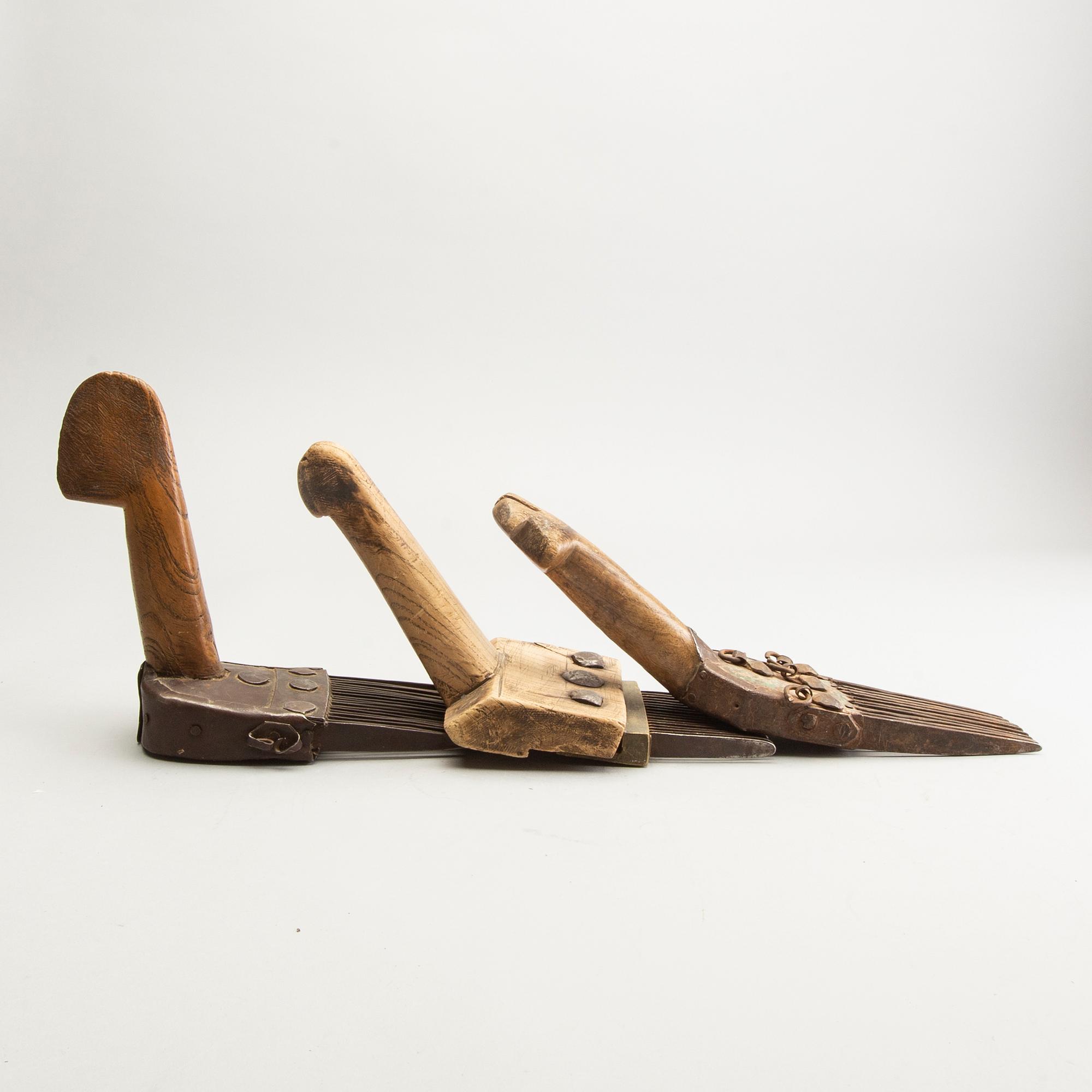 A set of 3 Persian carpet weavers combs and a wood printing block, 20th Century.