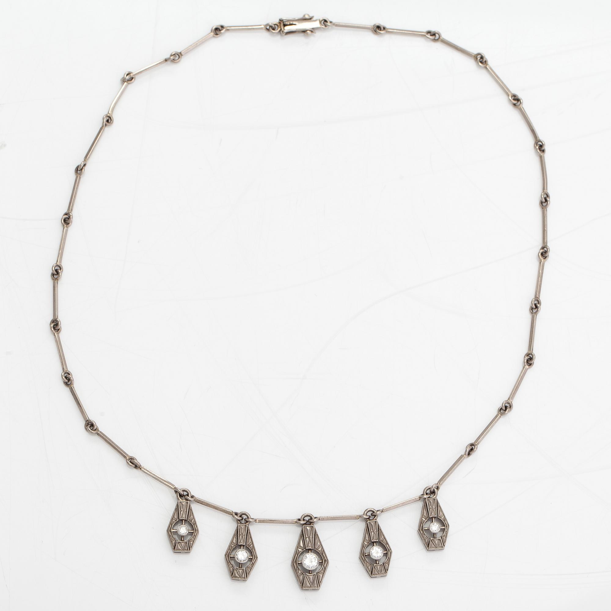 A necklace, ring and earrings, 14K gold and diamonds ca. 0.92 ct in total. Westerback, Helsinki 1964-1973.