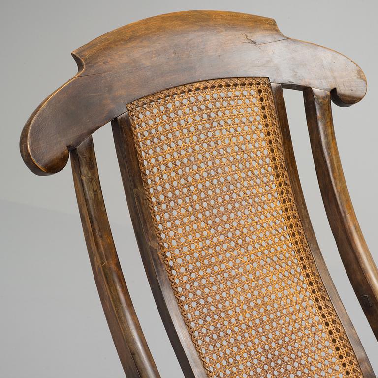 A stained wood and rattan deck chair, first half of 20th century.