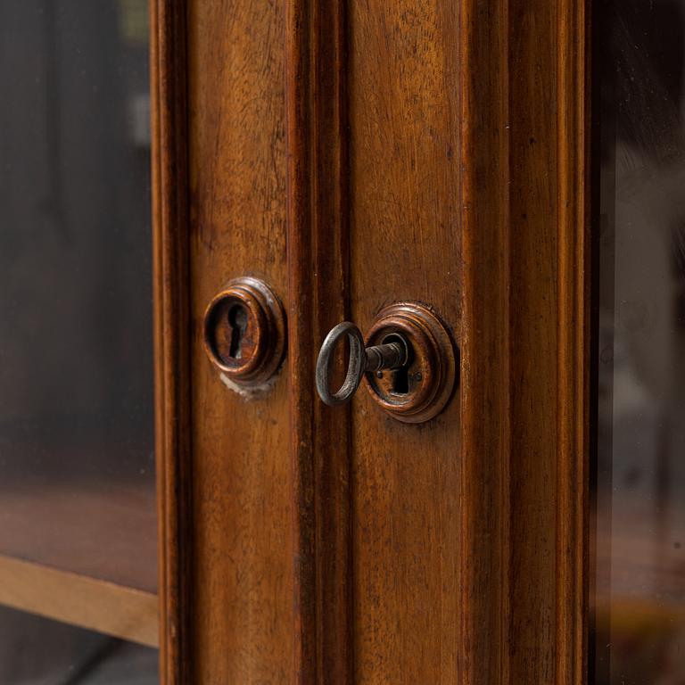 A mahogany veneered book cabinet ,second part of the 19th Century.