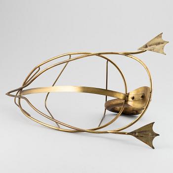 A 20th century grass newspaper stand in the shape of a swan.