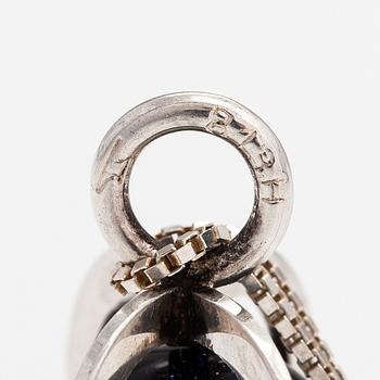 Elis Kauppi, A silver necklace with a purple goldstone. Kupittaan kulta, Turku.