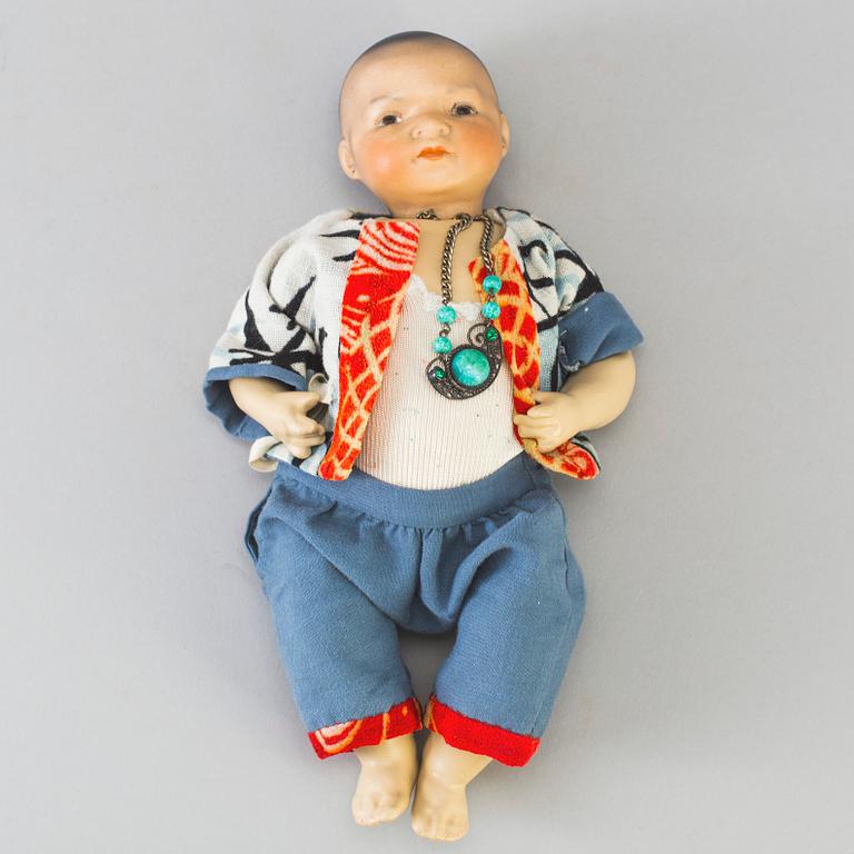 Two oriental bisque head baby dolls by Armand Marseille and Heubach Köppelsdorf, Germany, early 20th century.